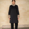 The black female coat with beige fur sleeves and collar