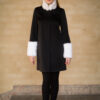 The Madeleine coat with white faux fur on the sleeves and collar